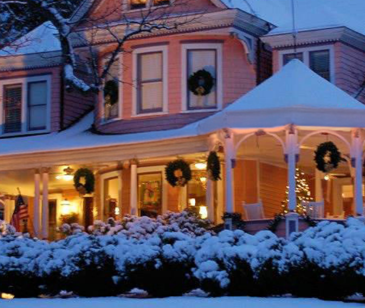 The Sister location of Albemarle, the ceader crest inn with holiday decor and a fresh blanket of snow